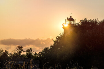 Poster - Tower of the old lighthouse against the evening sky	