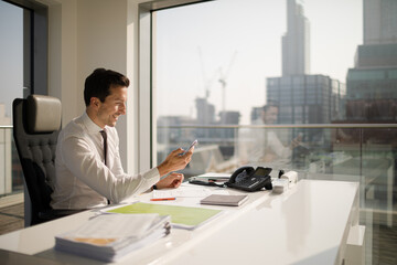 Businessman working at desk in modern office