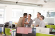 © KOTO - Business people talking in open plan office