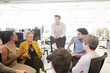© KOTO - Business people meeting at computer in open plan office