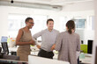 © KOTO - Business people talking in open plan office
