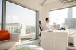 © KOTO - Businessman working at desk in modern office