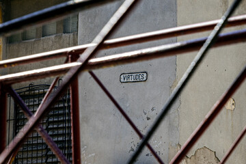 Poster - Old building behind a metal fence