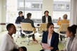 © KOTO - Enthusiastic business people working together in relax zone