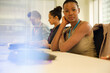 © KOTO - Portrait of smiling businesswoman sitting at conference room table