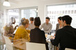 © KOTO - Business people enjoying sushi lunch