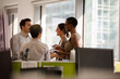 © KOTO - Business people talking in open plan office