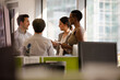 © KOTO - Business people talking in open plan office