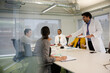 © KOTO - Businessman leading conference room meeting