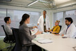 © KOTO - Businesswoman leading conference room meeting