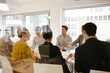 © KOTO - Business people enjoying sushi lunch