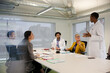 © KOTO - Businesswoman leading conference room meeting