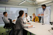 © KOTO - Businessman leading conference room meeting
