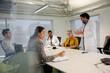 © KOTO - Businessman leading conference room meeting