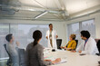© KOTO - Businesswoman leading conference room meeting