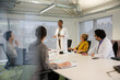 © KOTO - Businesswoman leading conference room meeting