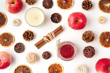 Autumn flat lay composition of apples, fall foods and decor on white background. Ingredients for jam or mulled wine. Autumn or winter holiday food concept. Creative trendy flat lay.