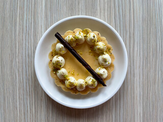 Wall Mural - Closeup of a tartlet with passion fruit cream.