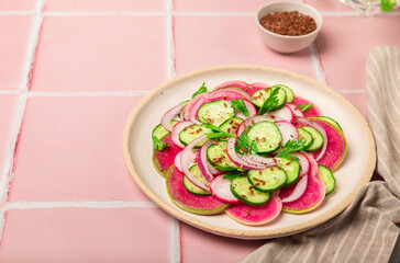 Wall Mural - Salad with watermelon radish, cucumber and red onion