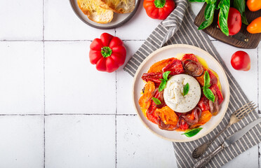 Wall Mural - Burrata cheese with baked tomatoes, pepper, red onion and fresh basil