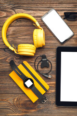 Different modern devices on wooden background