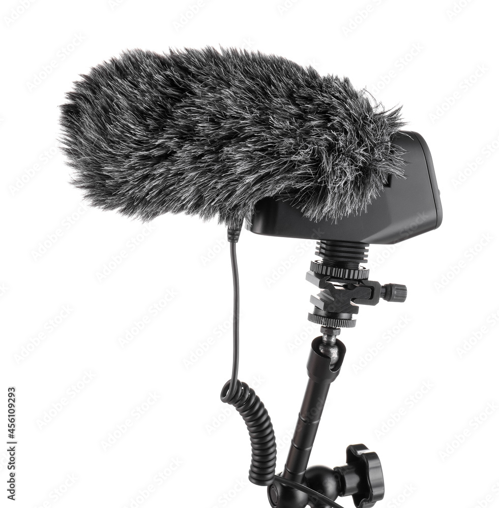 Modern microphone with furry cover on white background