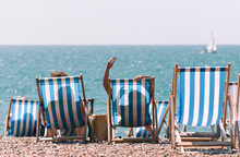 Blue And White Beach Chairs On The Beach