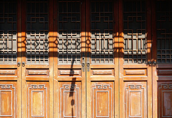 Wall Mural -  Foshan city, China. Xi Qiao Mountain Guoyi Movie and TV City.  The street  depicting Guangzhou street in real size in the early 20th century. Traditional wooden doors. 