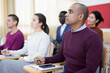 © JackF - Small group of students attentively listening to lecture in classroom