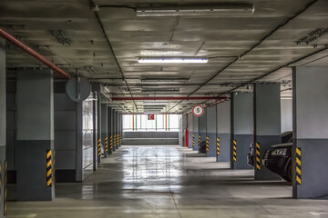 Parking in a residential building. Covered underground parking for cars