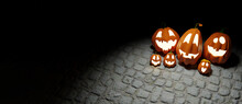 Halloween Funny Lantern Jack Pumpkins On Paving Stones Background. Rendering From 3D.