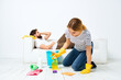 © SHOTPRIME STUDIO - a young couple near the sofa detergent rags sponges provision of services
