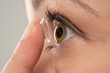 © vladimirfloyd - Close-up shot of young woman wearing contact lens