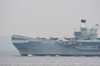 Royal Navy aircraft carrier HMS Queen Elizabeth sailing in Tokyo Bay.