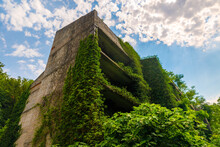 Old Unfinished Stone Building Overgrown With Plants