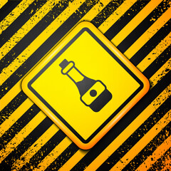 Sticker - Black Soy sauce bottle icon isolated on yellow background. Warning sign. Vector