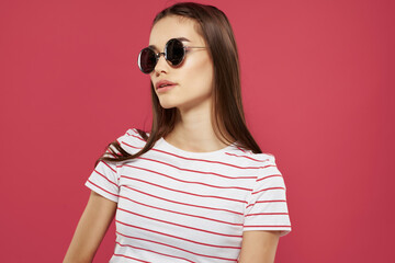 Wall Mural - cheerful pretty woman wearing sunglasses striped tshirt fashion modern style