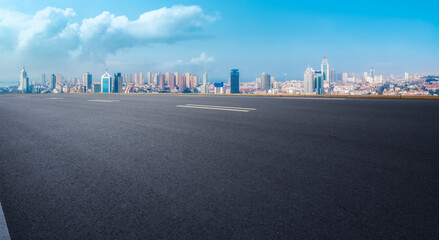 Wall Mural - Road and city buildings background