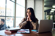 © BullRun - Contemplative female student with digital laptop computer thoughtful looking away while thinking about education e learning, pensive hipster girl with netbook pondering about freelance job
