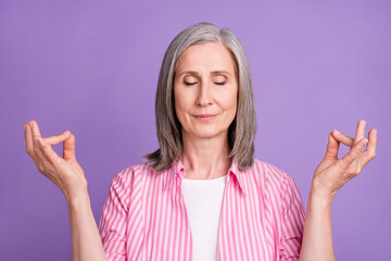 Sticker - Photo of aged woman happy positive smile meditate yoga om balance zen isolated over violet color background