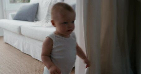 happy baby boy toddler learning to walk exploring home having fun curious infant walking through house enjoying childhood 4k footage