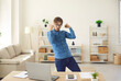 © Studio Romantic - Happy excited euphoric business man or student with laptop celebrating success doing Woohoo Woo hoo Yes Yeah Great Hooray Hurray fist pump gesture. Emotional guy has project approved or gets work done