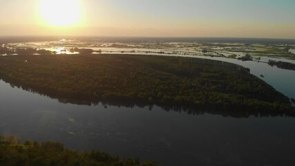 Wall Mural - Aerial view of big siberian Ob river, river bank in beauty summer evening, 4K drone footage.