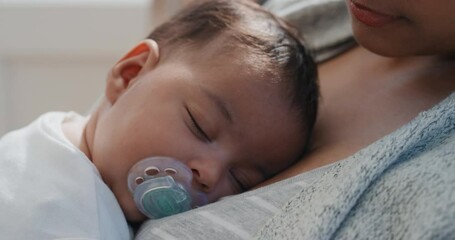 baby sleeping peacefully in mothers arms loving mother holding infant caring for sleepy toddler at h
