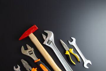 various repair tools on black background