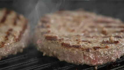 Poster - grilling and flipping beef patty for hamburger