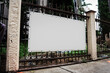 © Bonsales - Empty white advert banner with mockup space hanging on metal fence