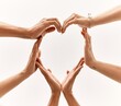 © Krakenimages.com - Group of young friends with hands together doing heart symbol.
