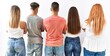 © Krakenimages.com - Group of young friends standing together over isolated background standing backwards looking away with crossed arms