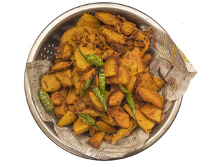 Poster - Overhead shot of Indian homemade fried potato chips with green chili on isolated background